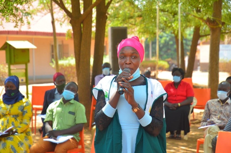 Afisa, reciting a poem during the launch of the Yumbe District Local Action Plan in March 2021. Photo credit: CoACT