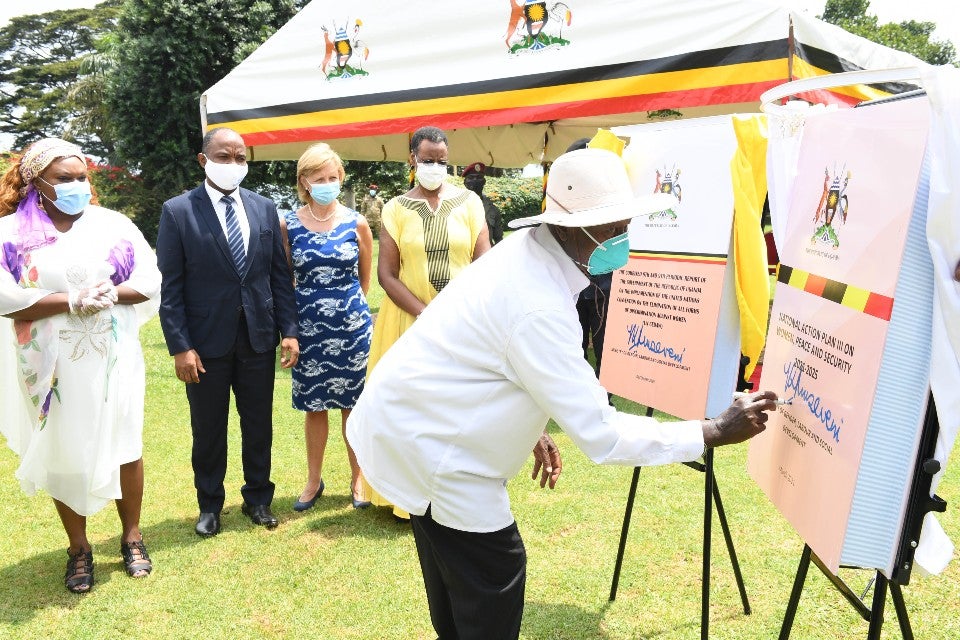 President Yoweri Museveni launching the National Action Plan III on Women, Peace and Security 2021-2025 as the UN Resident Representative, Rosa Malango (left), UN Women Representative Dr Maxime Houinato (second left), Norwegian Ambassador