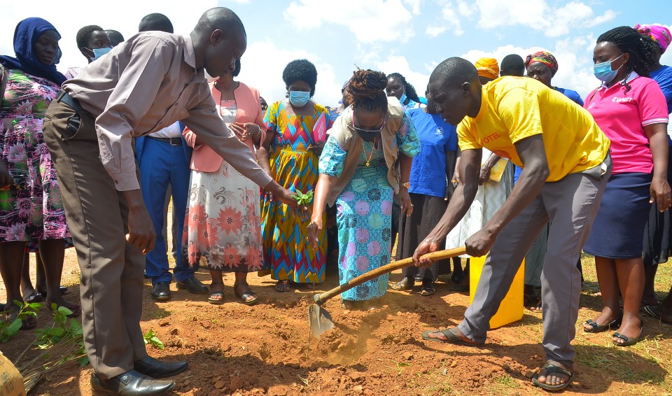UN Women Deputy Country Representative, Ms. Adekemi Ndeili planting a tree during the launch of the Kaberamaido LAP in March 2021. Photo: Coalition for Action (CoACT)