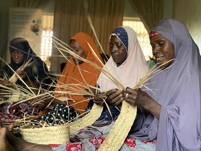 UN Women Beneficiaries weaving locally made mats at Women Empowerment Hub in Maiduguri. Photo: UN Women/ Marian Roberts