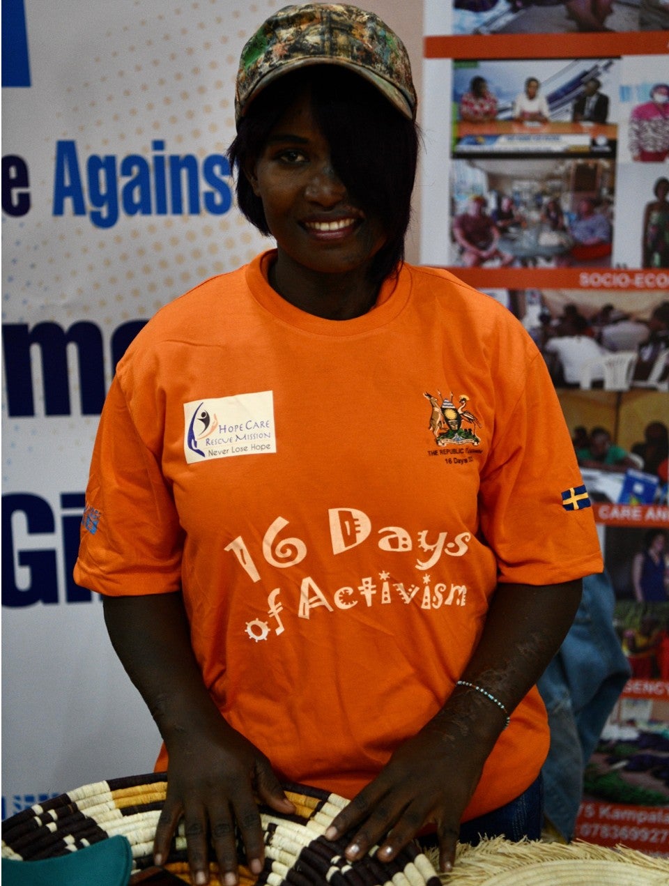 Julie shows off her woven baskets for sale at the 16 Days Acid Attack Dialogue in Kampala