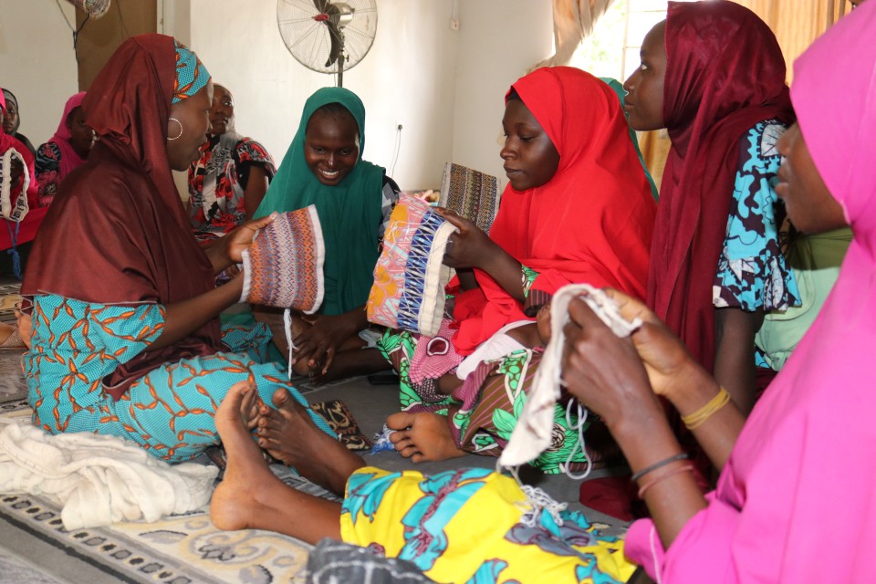 Women knitting caps to be sold at the Empowerment Hub in Maiduguri. Photo credits: UN Women/ Marian Roberts