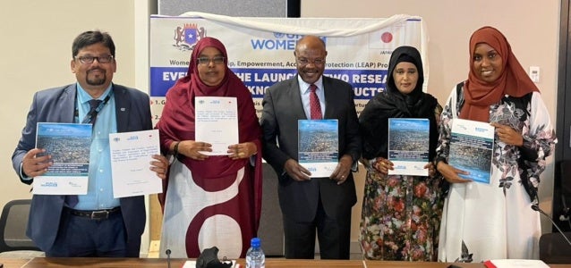 Somalia team holding books